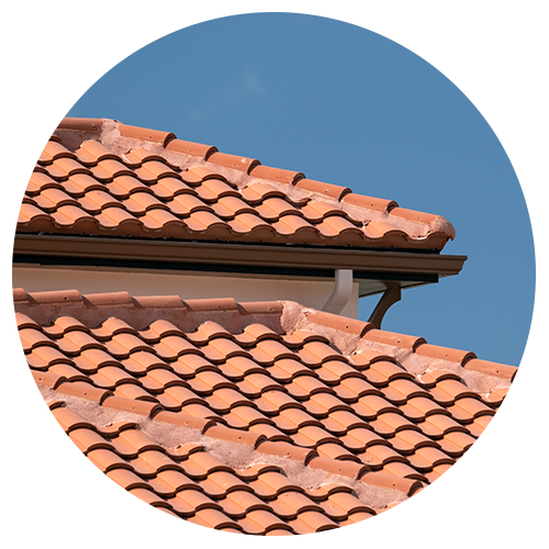 Orange tile roof against blue sky 